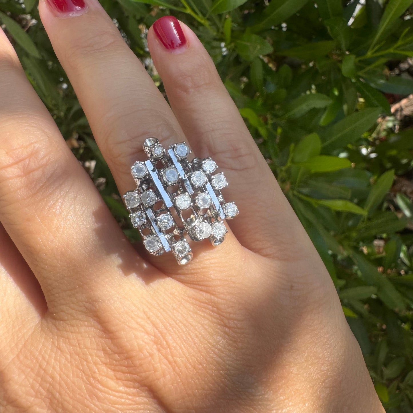 14K gold ring with a geometric design, set with multiple round Diamonds that create a sparkling, structured look.