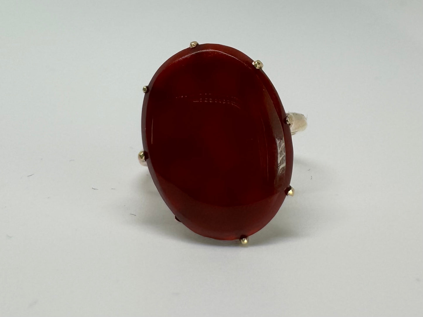 14K gold ring set with a glowing oval Carnelian