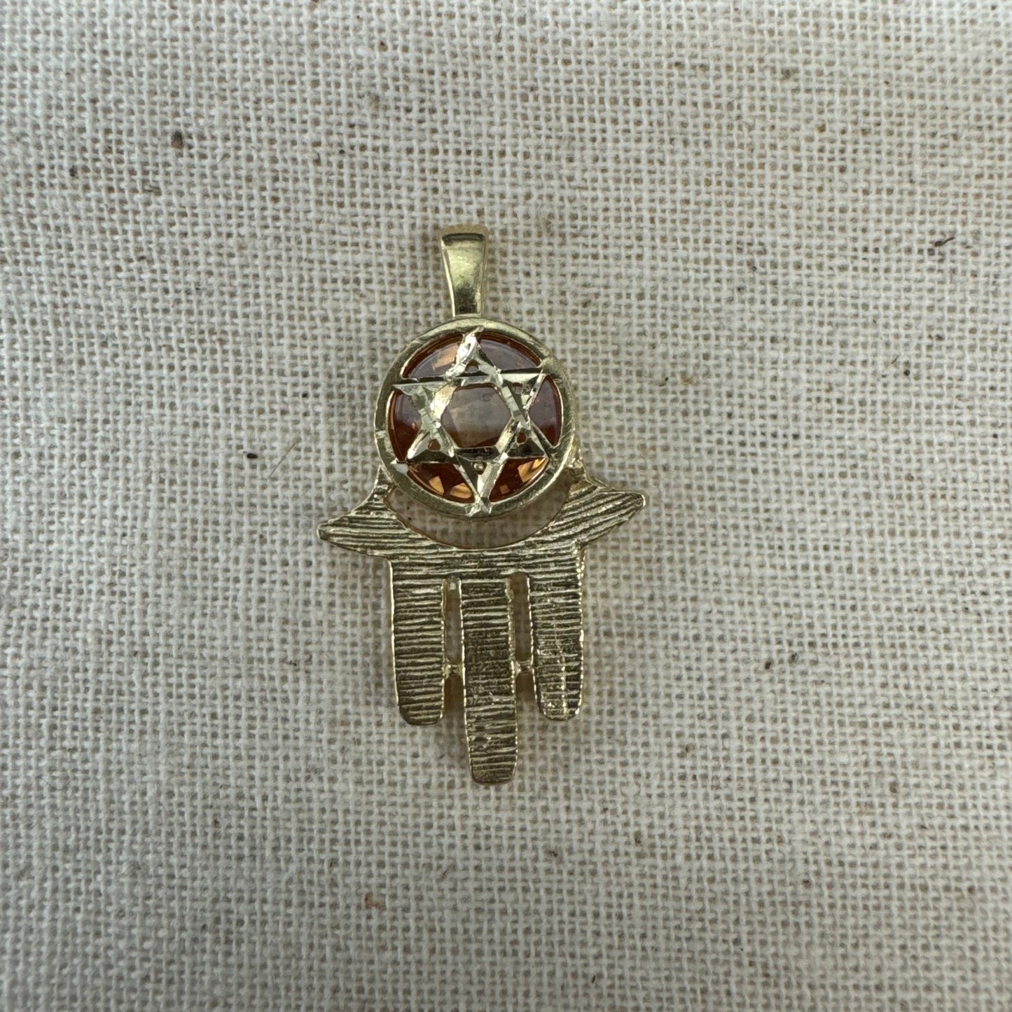 14K gold Hamsa pendant, featuring a deep orange gemstone framed by a Star of David.