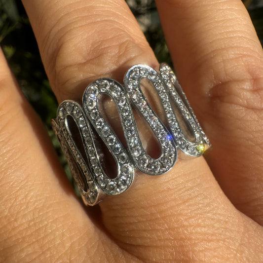 14K gold ring set with shimmering Diamonds in a flowing wave design