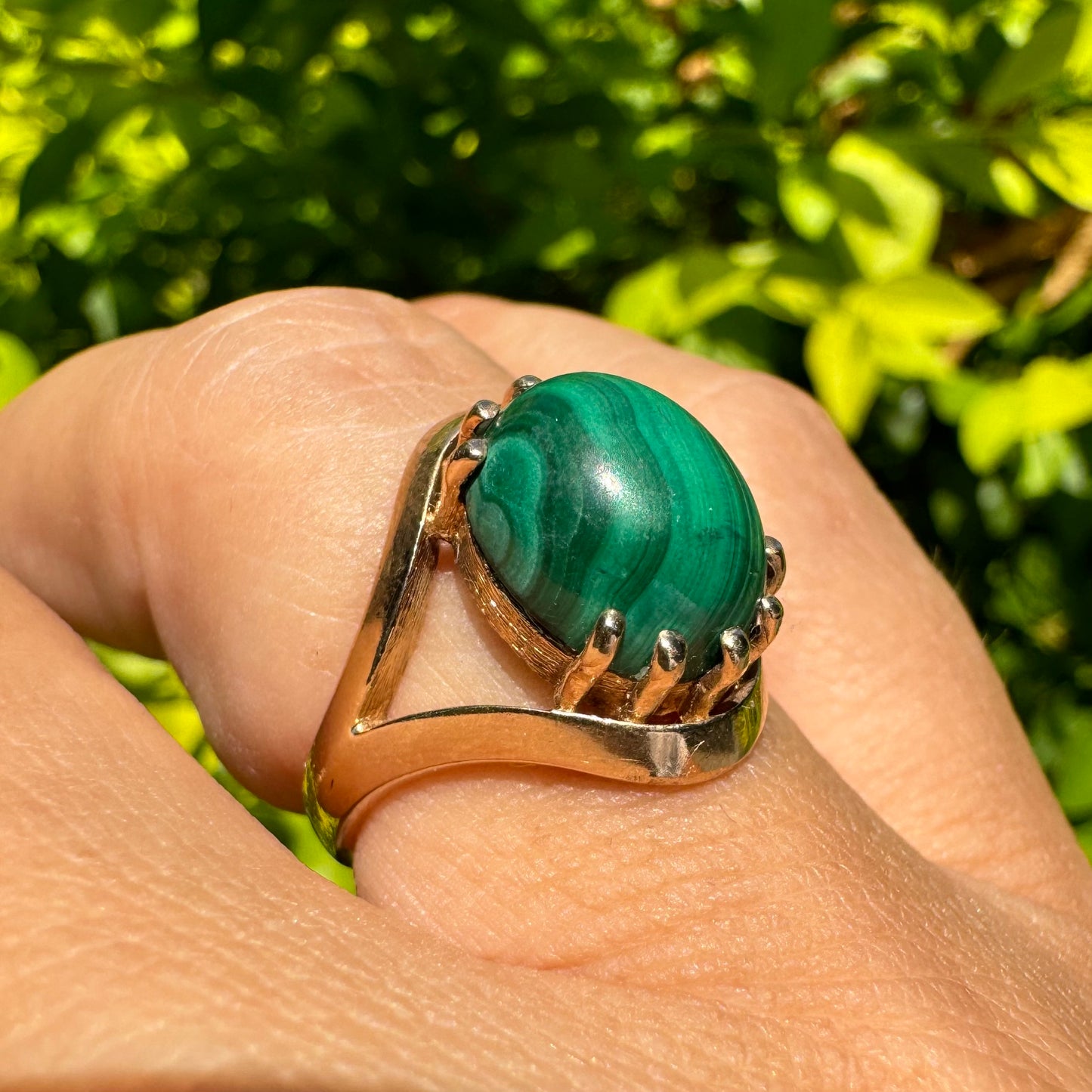 14K gold ring set with a polished Malachite cabochon