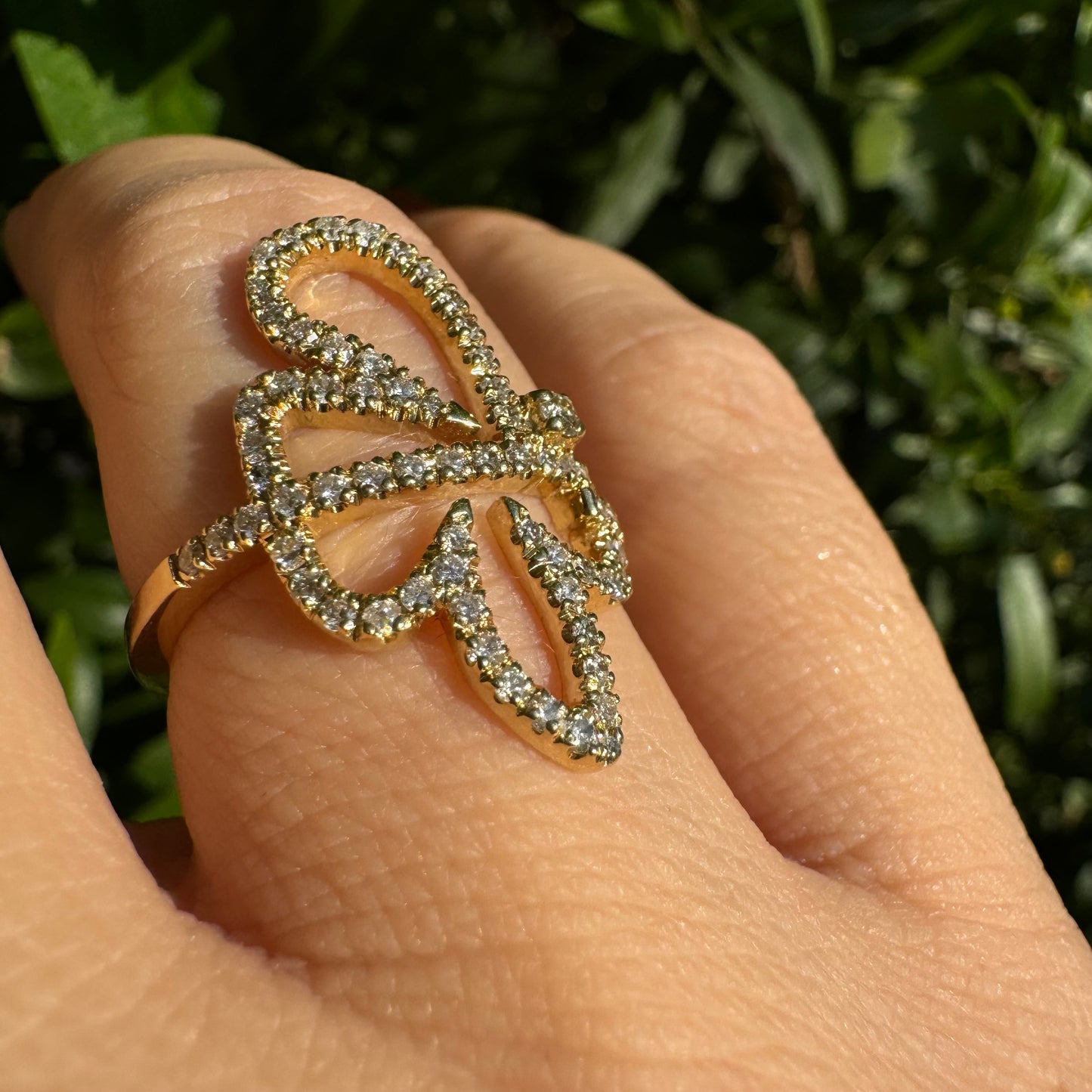 14K gold ring in an open butterfly design, outlined with sparkling Diamonds