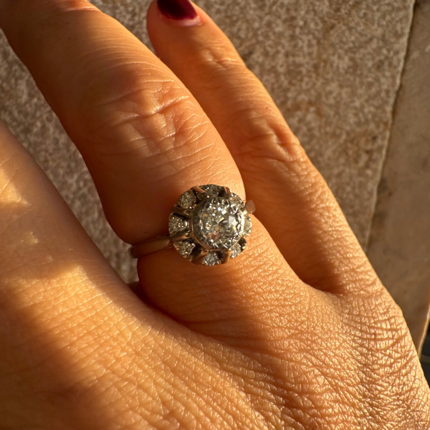 18K gold ring set with Diamonds in     a classic cluster-style