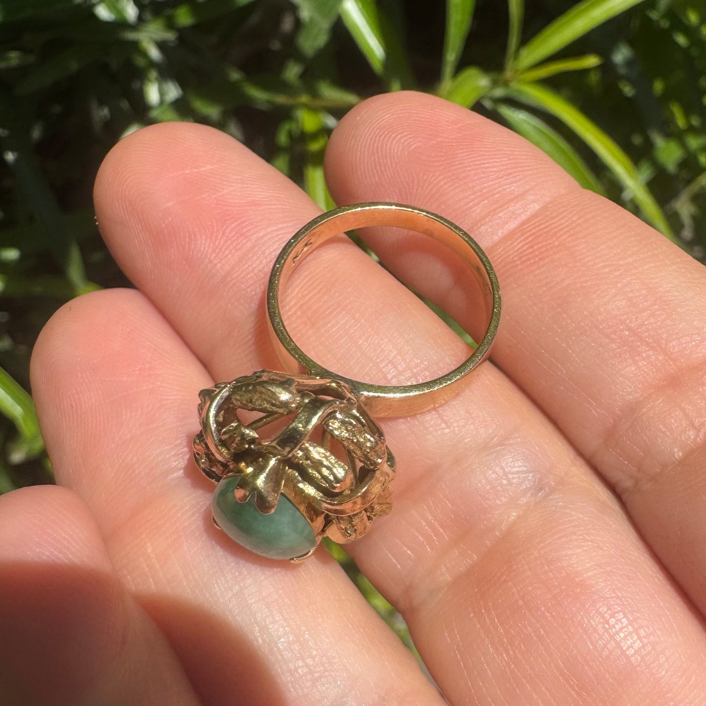 14K gold ring set with a pear-shaped Jade cabochon