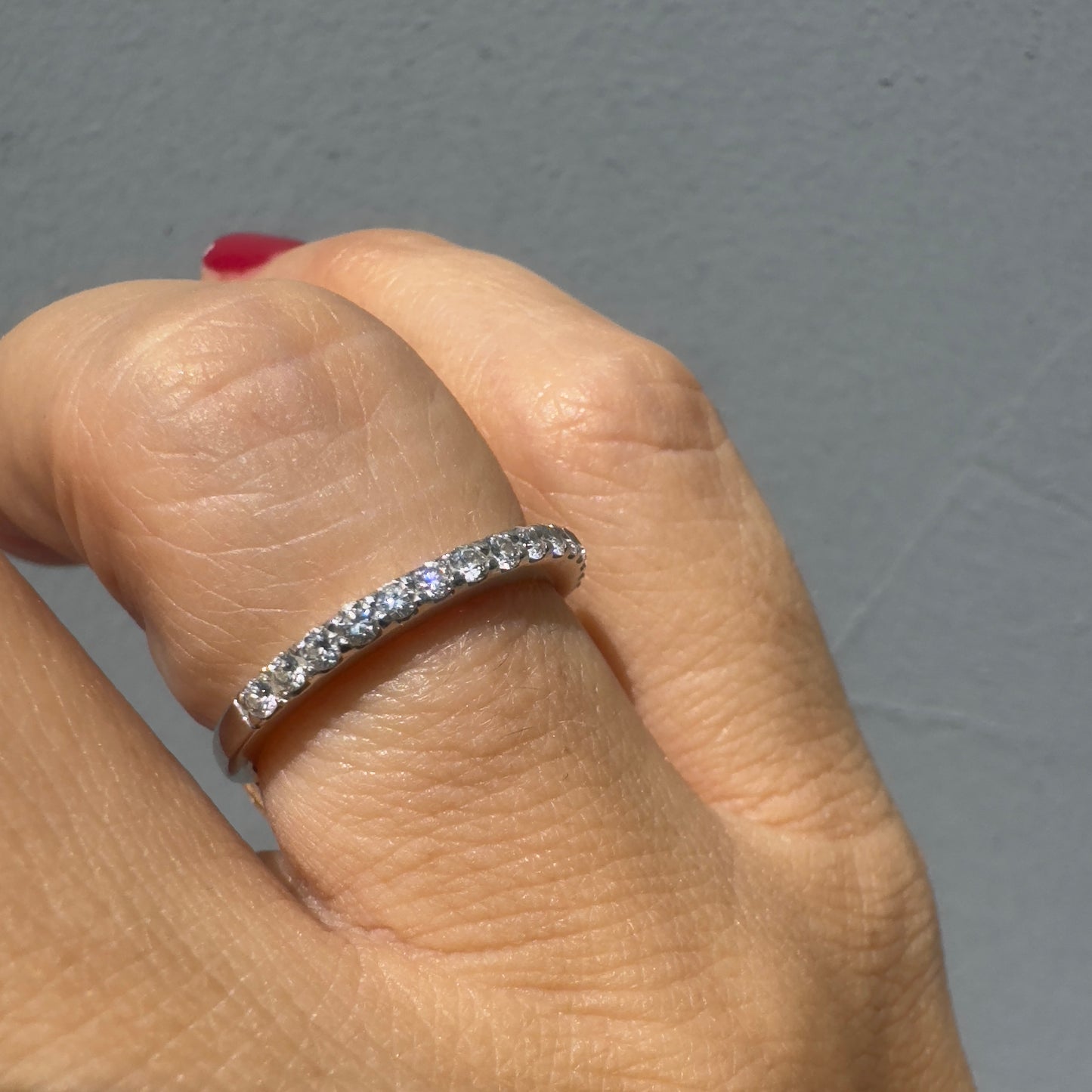 14K gold half-eternity ring set with a row of sparkling round Diamonds.