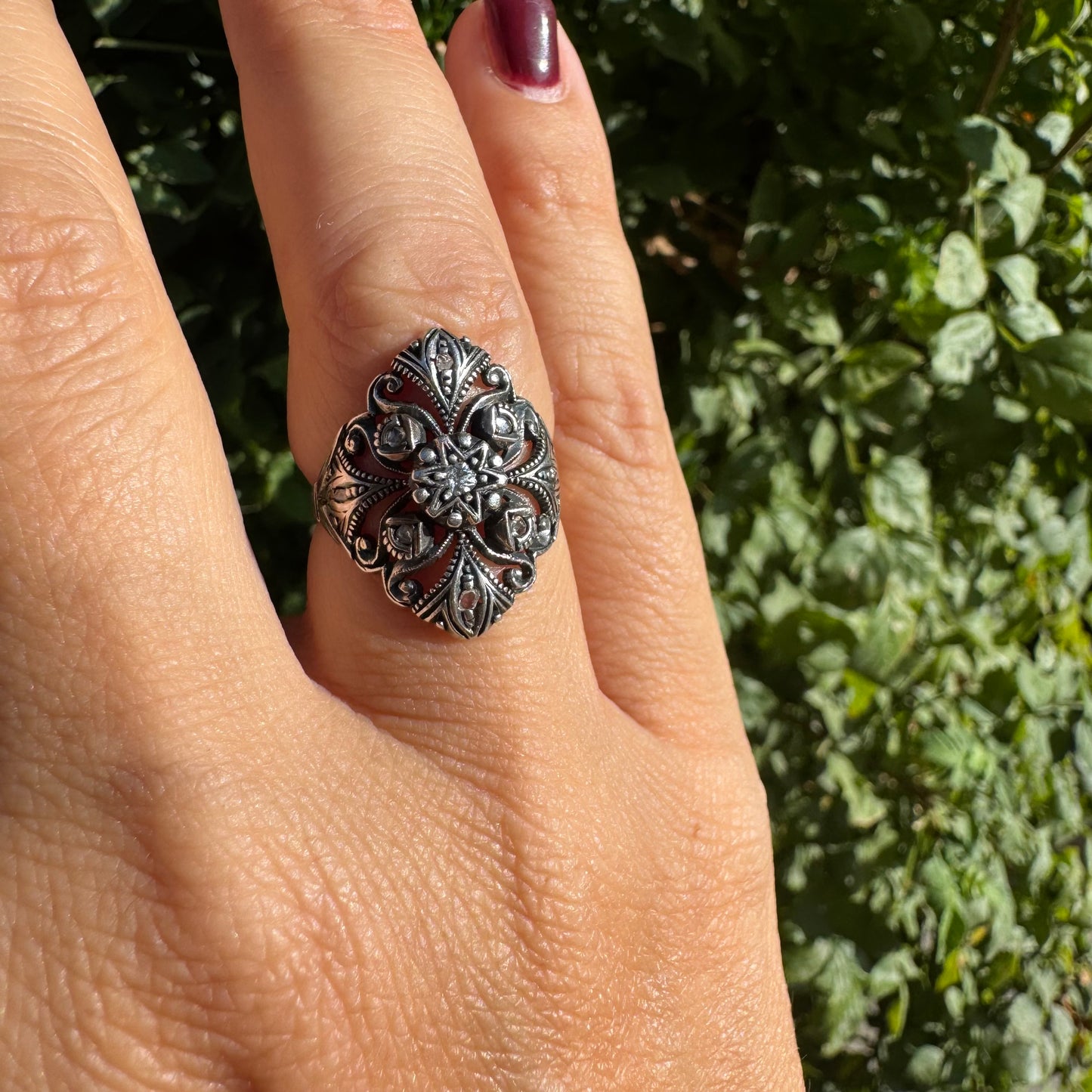 18K gold & silver ring with an intricate floral and leaf filigree design set with Diamonds