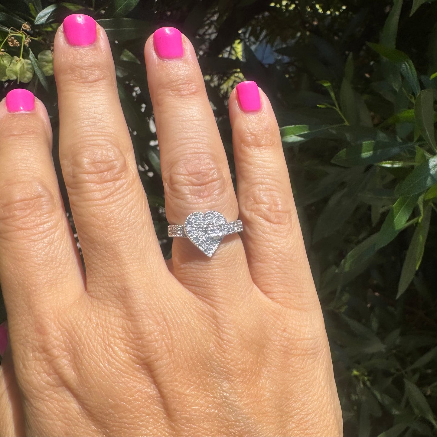 14K gold heart-shaped ring encrusted with shimmering Diamonds