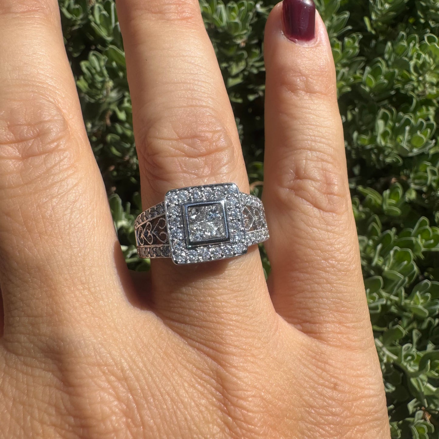 14K gold ring featuring a square cluster of princess-cut Diamonds in the center, surrounded by a double halo of smaller round Diamonds & gold details along the band.