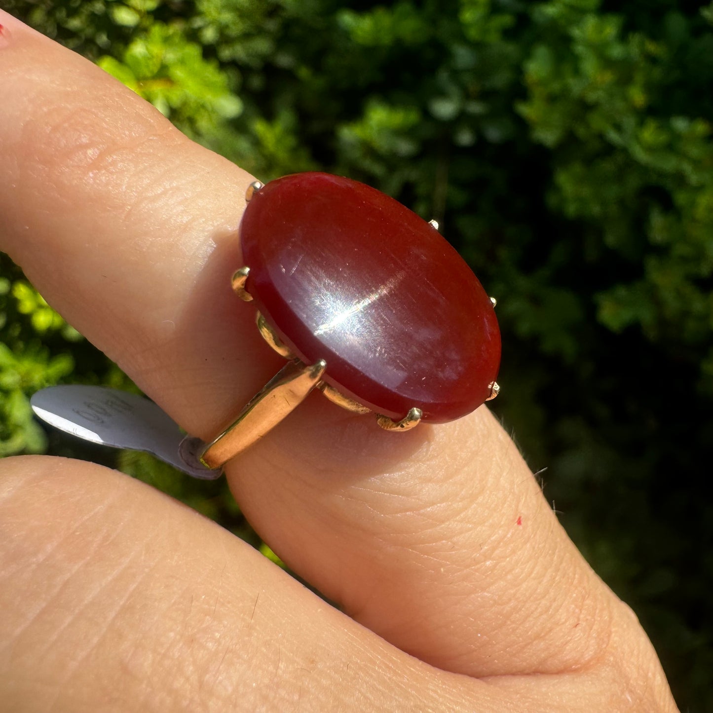 14K gold ring set with a glowing oval Carnelian