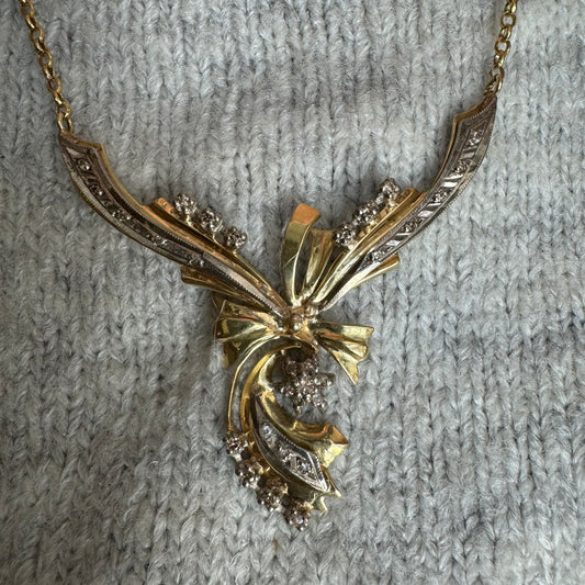 18K two-tone vintage necklace with a unique and elegant design set with Diamonds