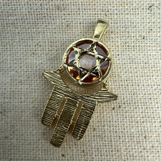 14K gold Hamsa pendant, featuring a deep orange gemstone framed by a Star of David.