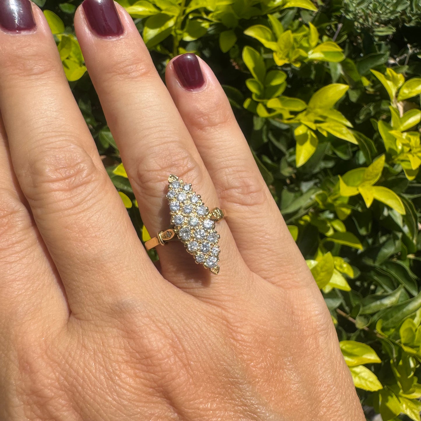 18K gold marquise-shaped ring set with multiple rows of sparkling Diamonds