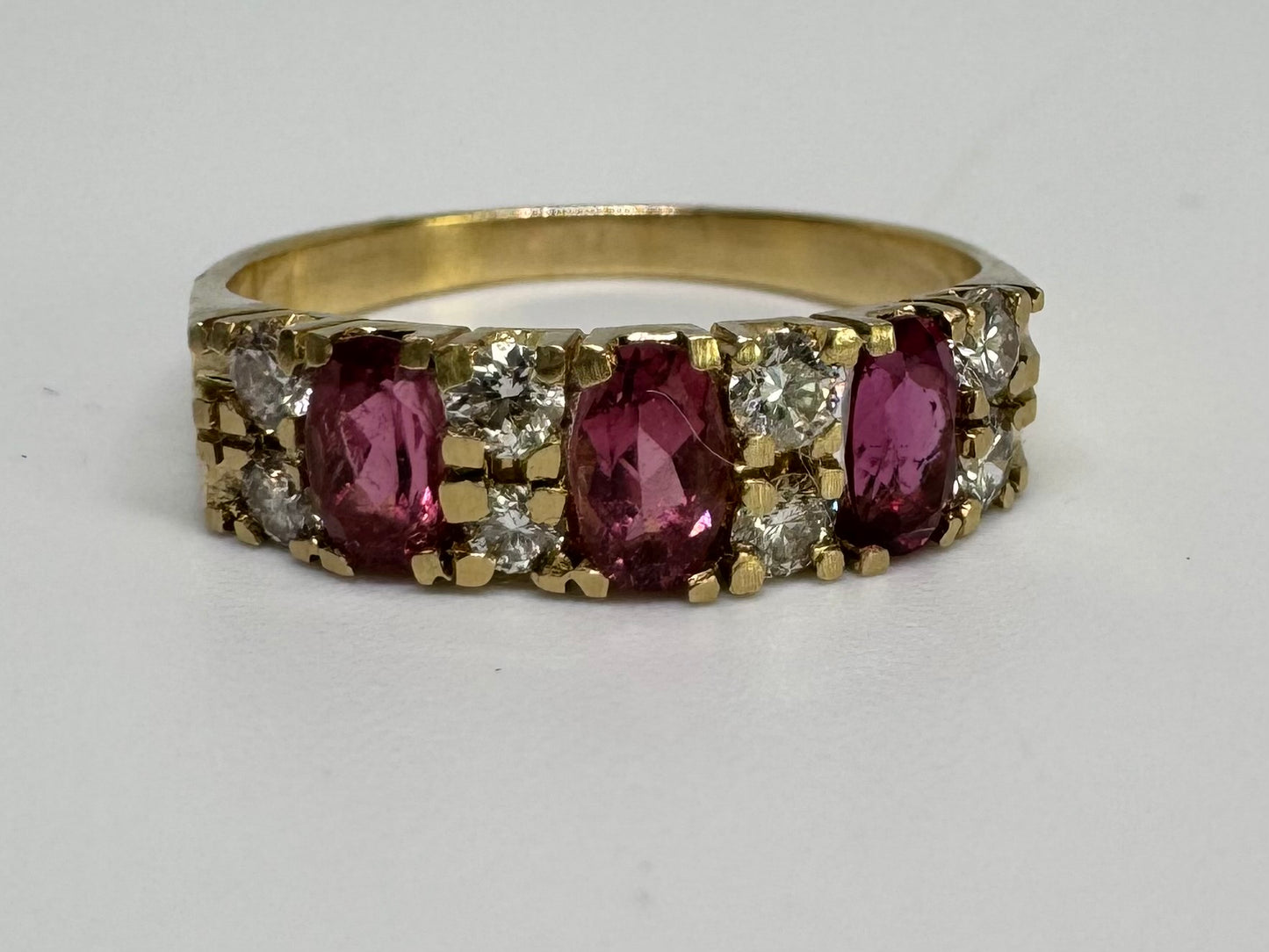 14K gold ring set with oval Pink Tourmalines and round brilliant-cut Diamonds