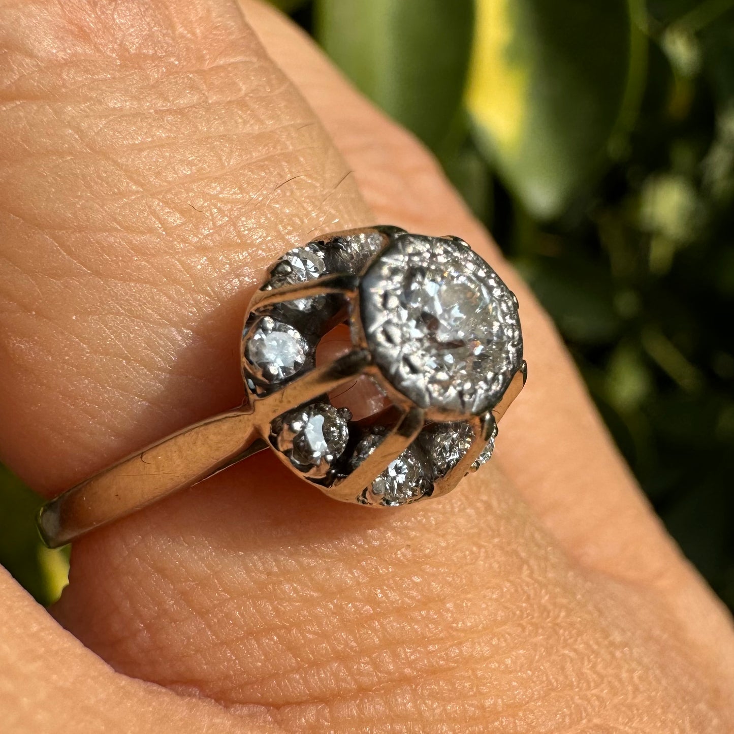 18K gold ring set with Diamonds in     a classic cluster-style