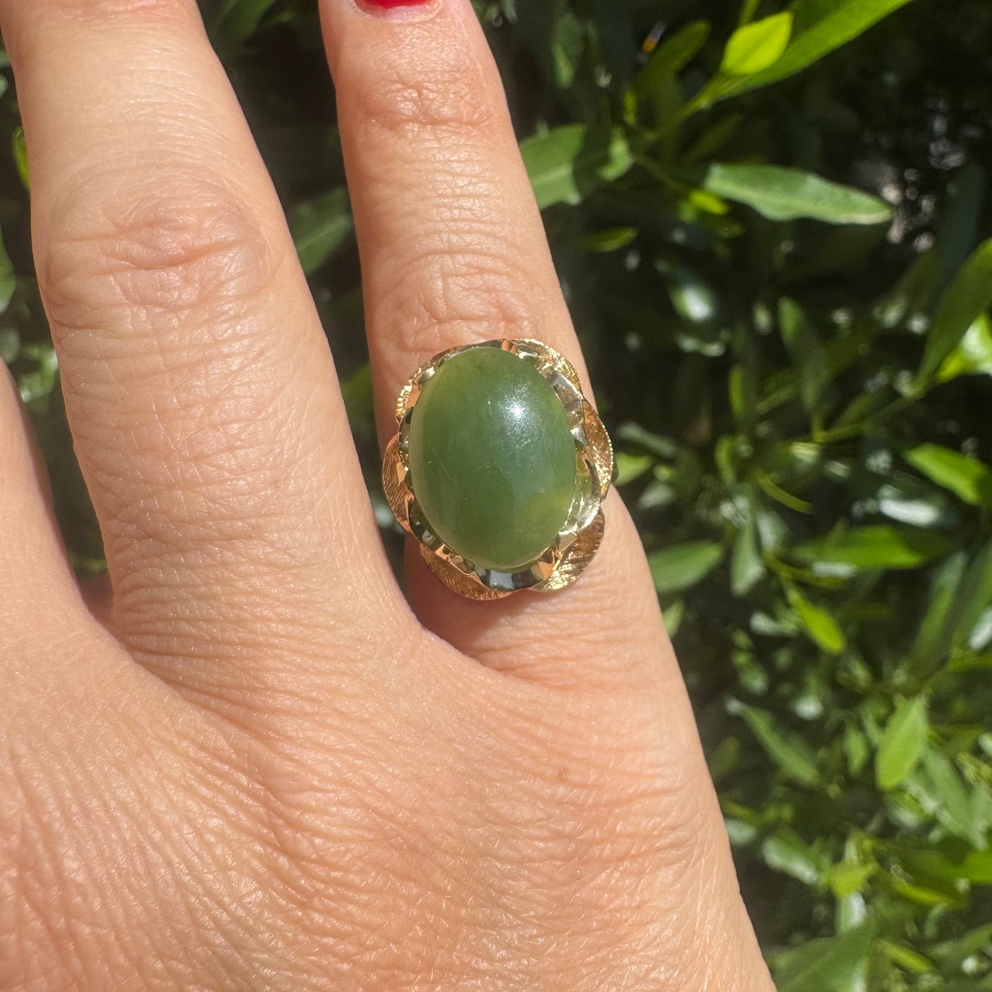 14K gold ring set with a large green Jade cabochon