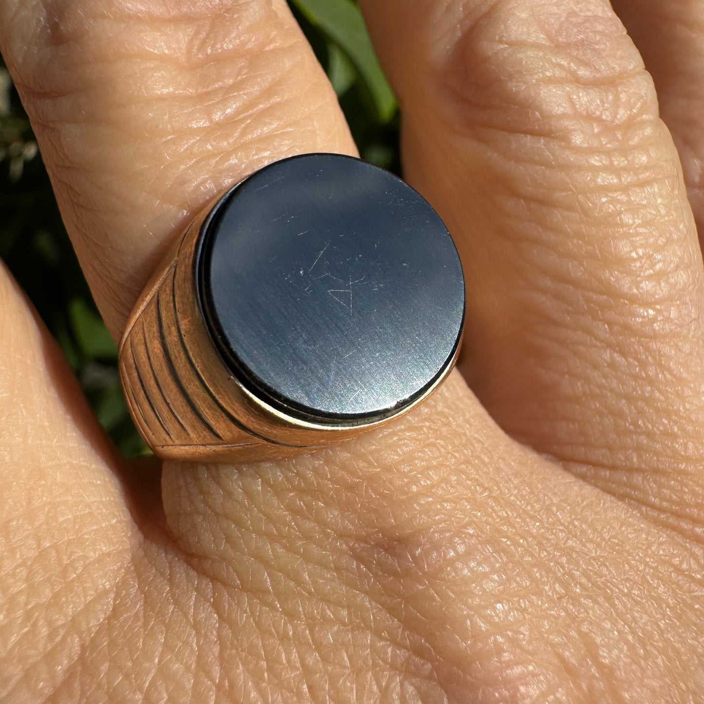 14K gold signet ring crafted in yellow gold, set with a smooth Black Onyx.