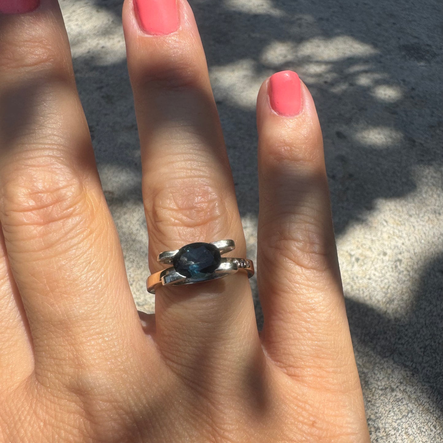 14K gold ring set with an oval-cut Blue Topaz “London”