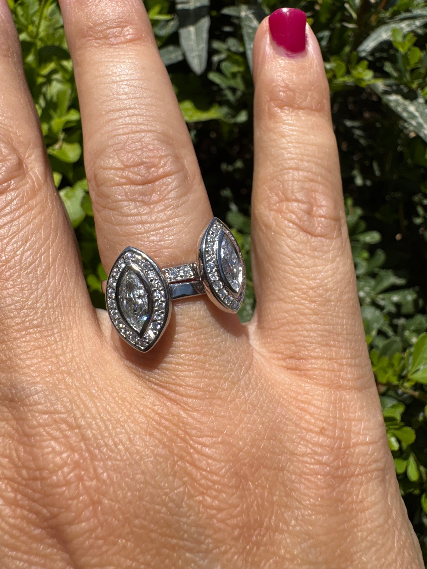 18K gold convertible ring set with two marquise-cut diamond halos that magnetically connect into a bold statement piece