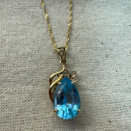14K gold necklace set with Blue Topaz pendant in a teardrop cut
