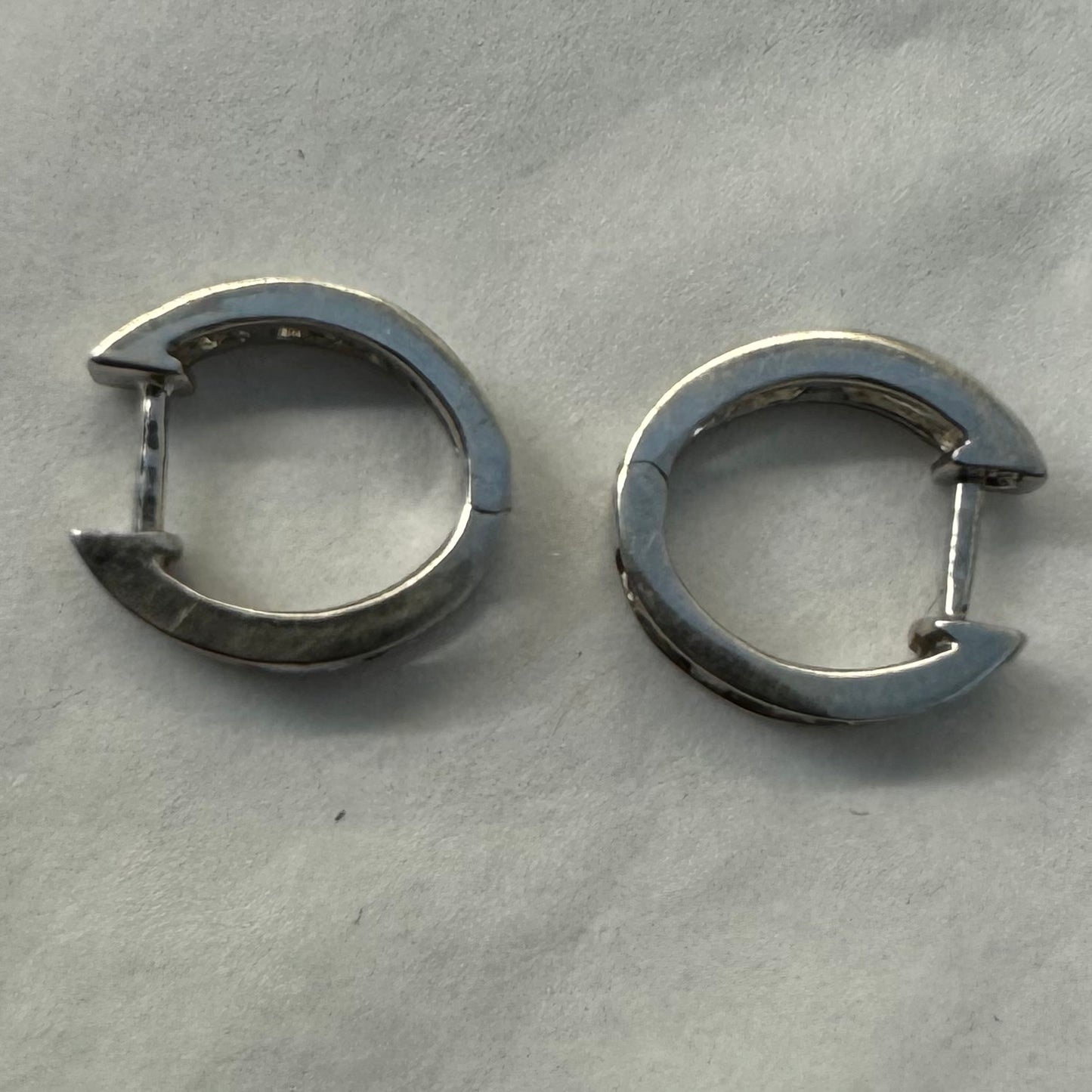 14K gold hoop earring set with a line of baguette-cut Diamonds