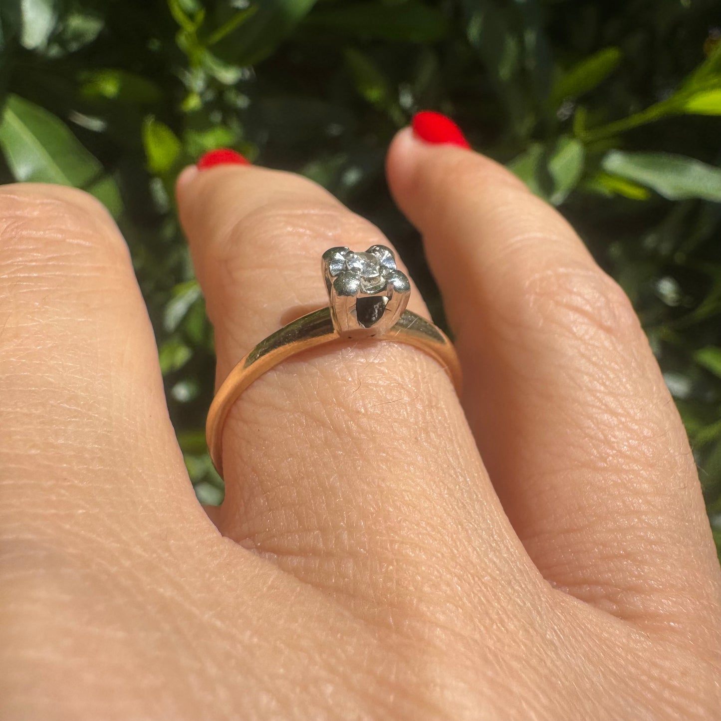 14K gold solitaire ring set with a small round Diamond