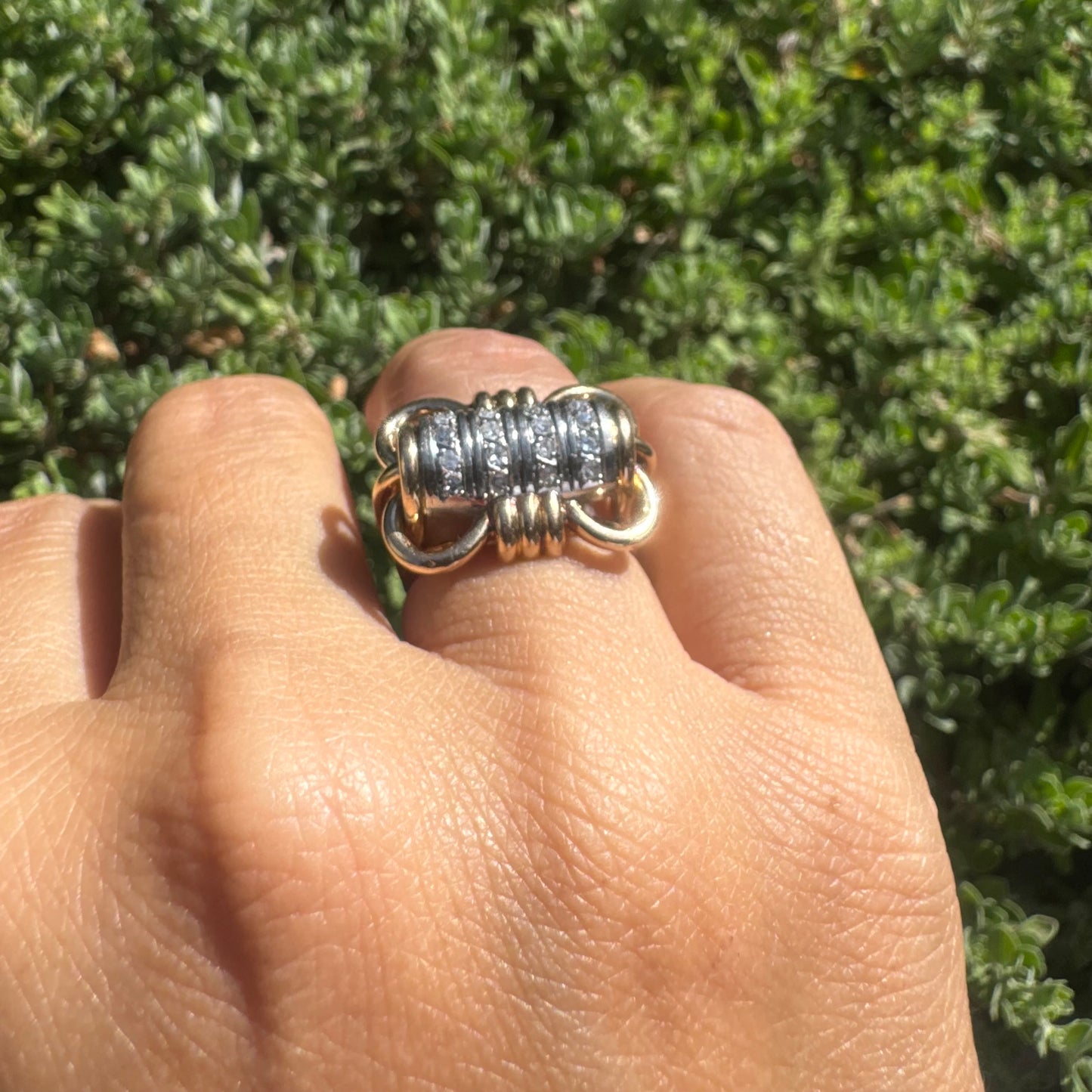 18K gold ring with a barrel-shaped centerpiece, crafted in yellow and white gold and set with sparkling Diamonds.