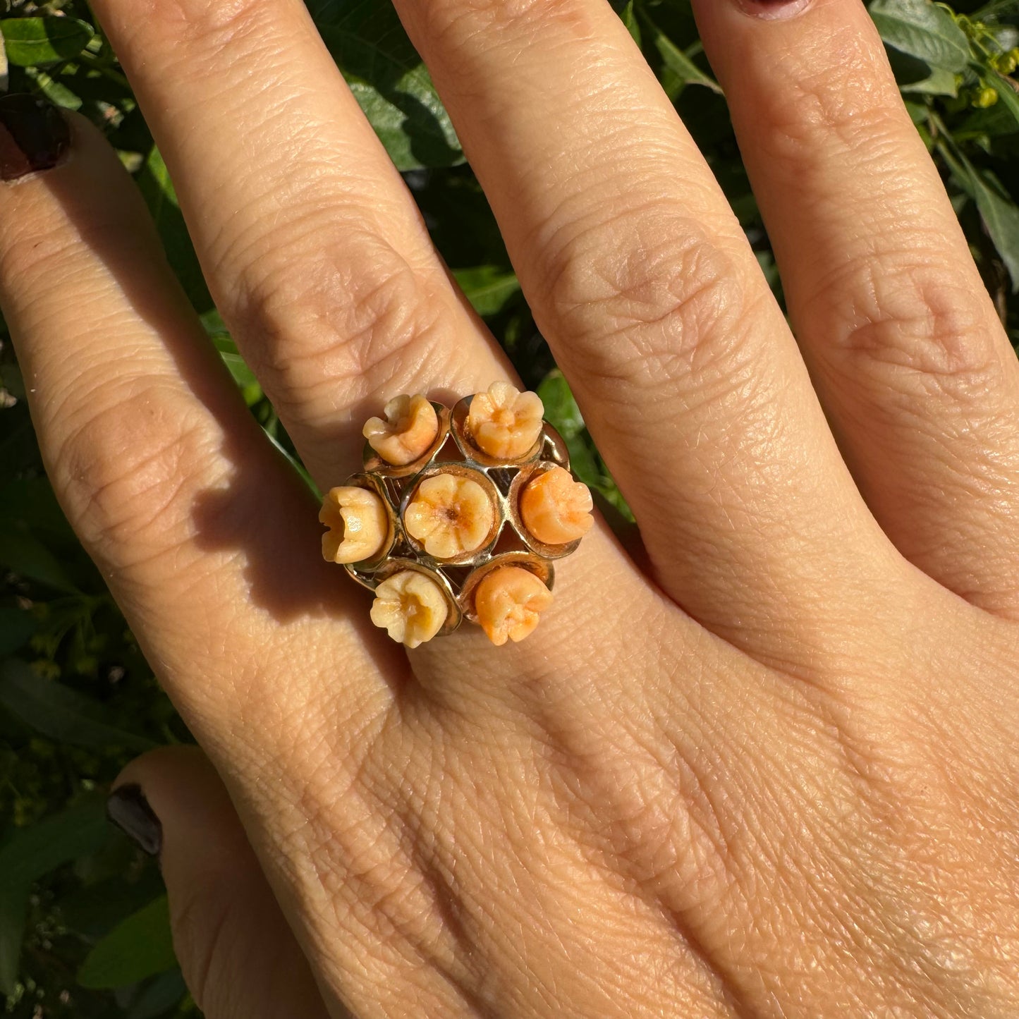 9K gold ring featuring a cluster design with carved Coral flowers in warm orange tones