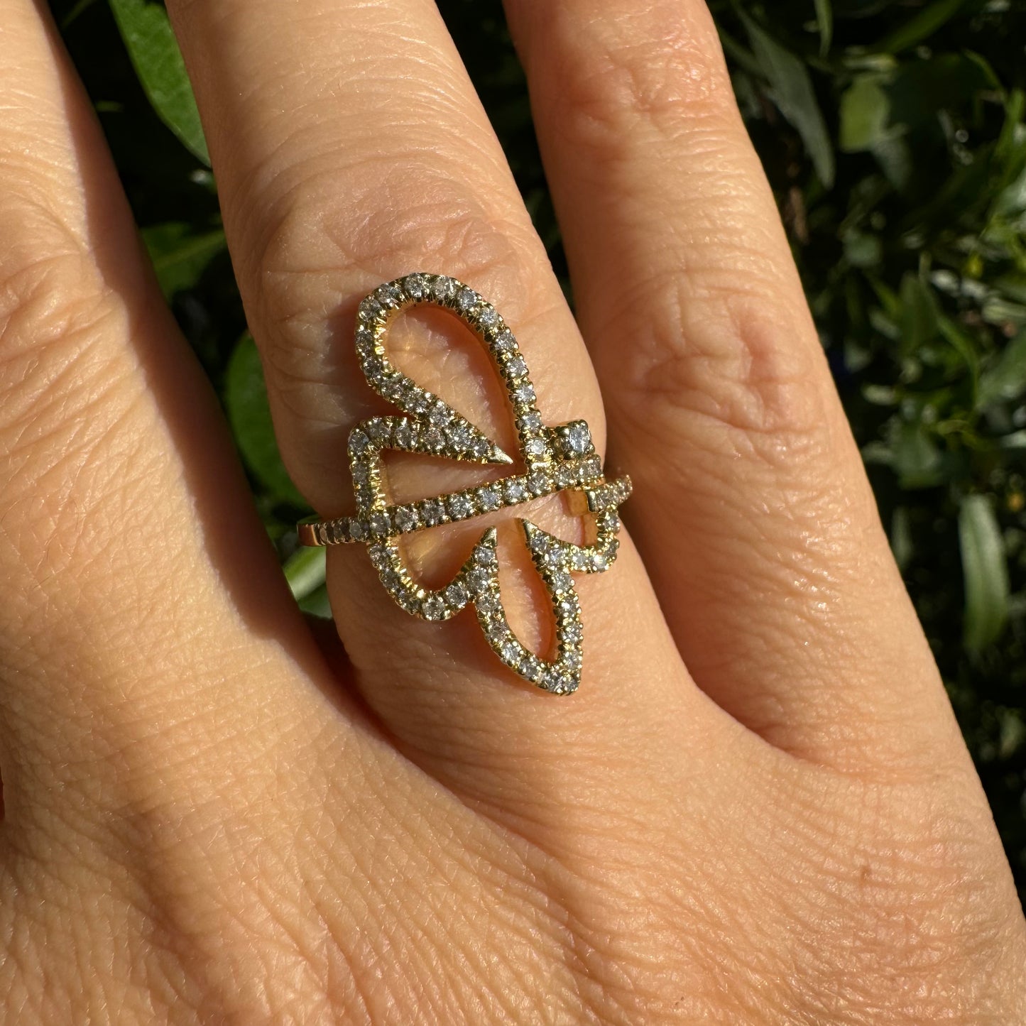 14K gold ring in an open butterfly design, outlined with sparkling Diamonds