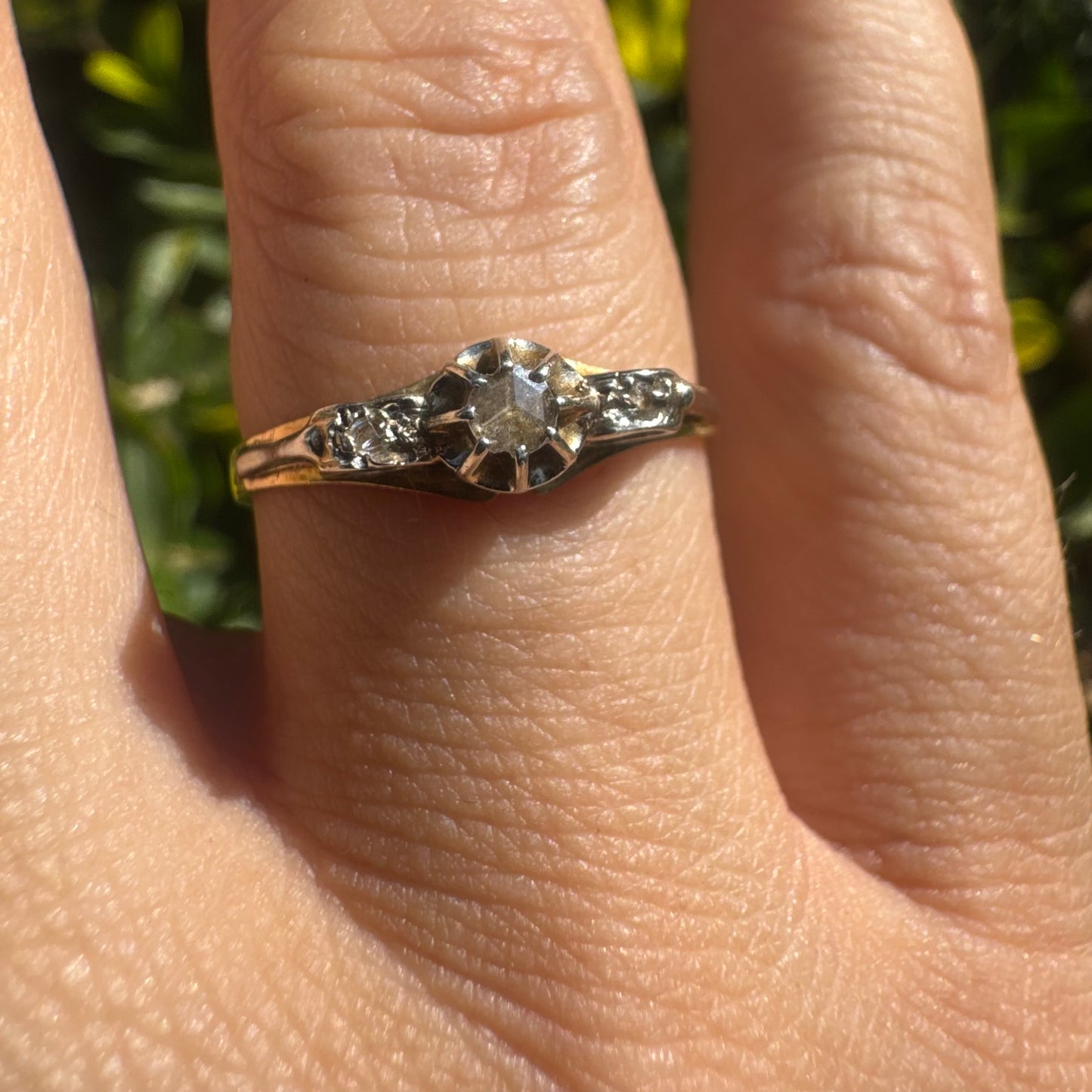 18K gold ring set with an old-cut center Diamond & side Diamonds