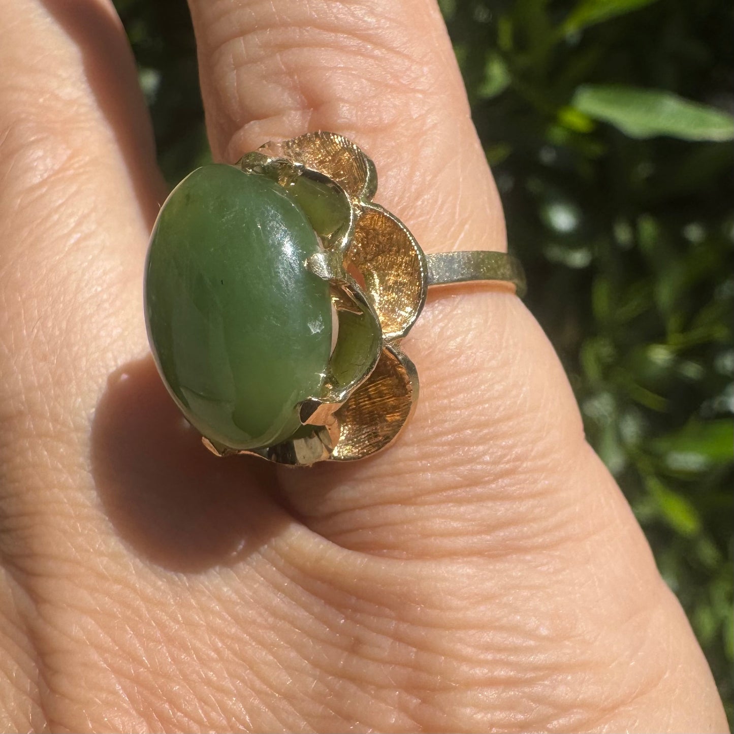 14K gold ring set with a large green Jade cabochon