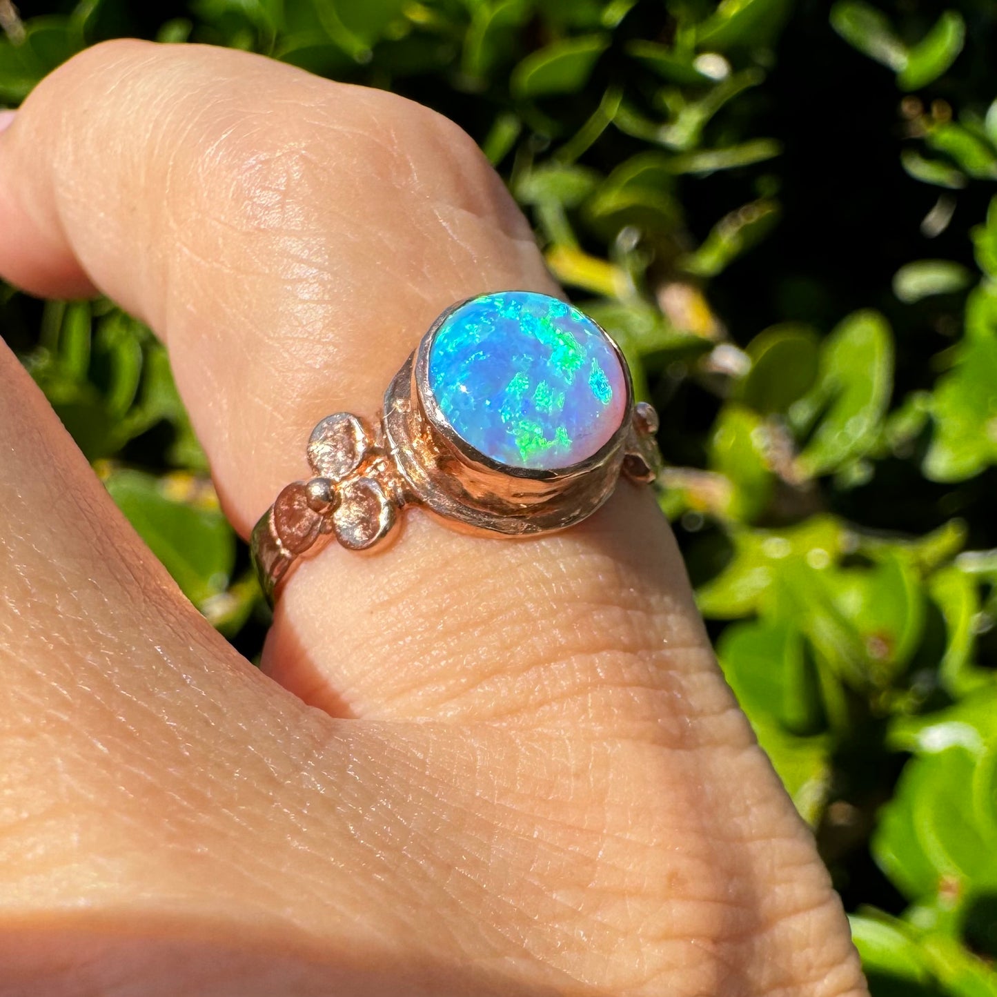 10K gold ring set with round Opal with vibrant flashes of blue, green and white