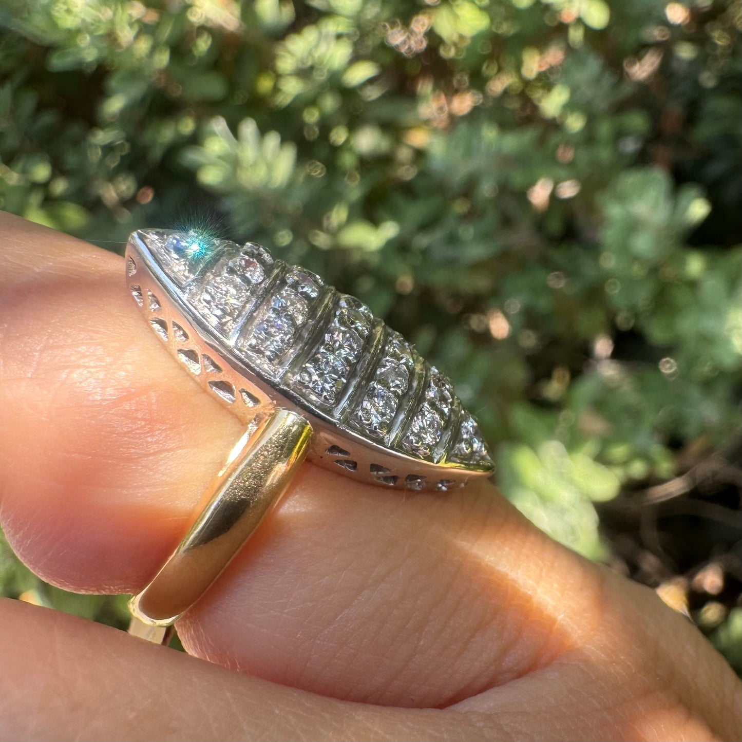 18K gold marquise-shaped ring set with multiple rows of sparkling Diamonds