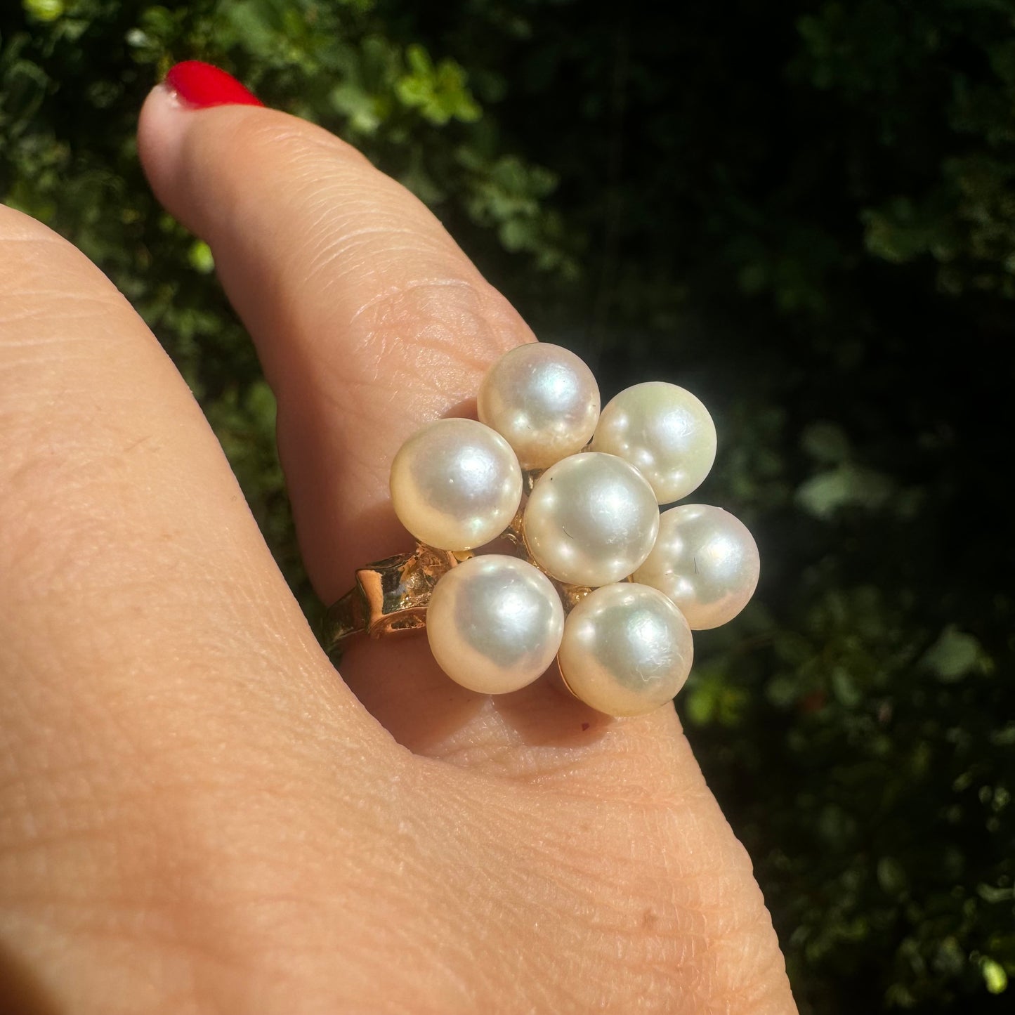 14K gold ring set with seven round Pearls in a bold floral cluster
