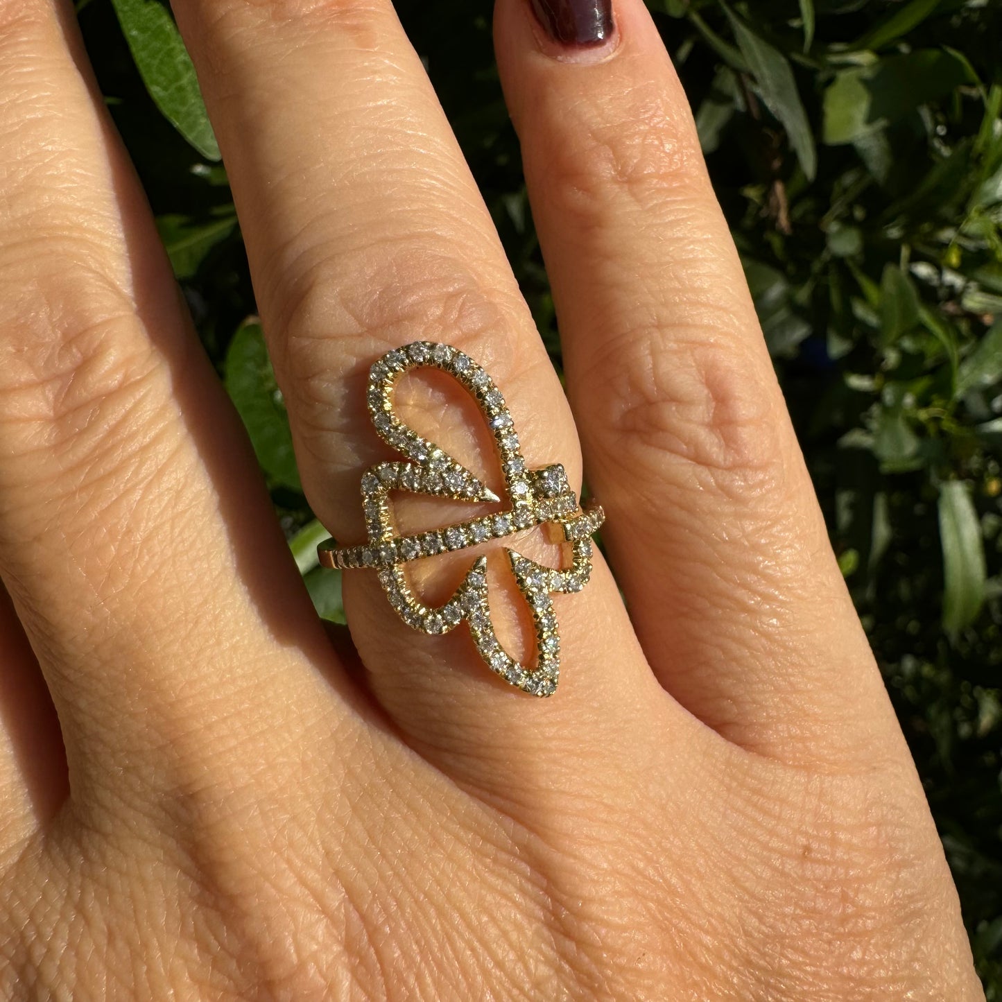 14K gold ring in an open butterfly design, outlined with sparkling Diamonds