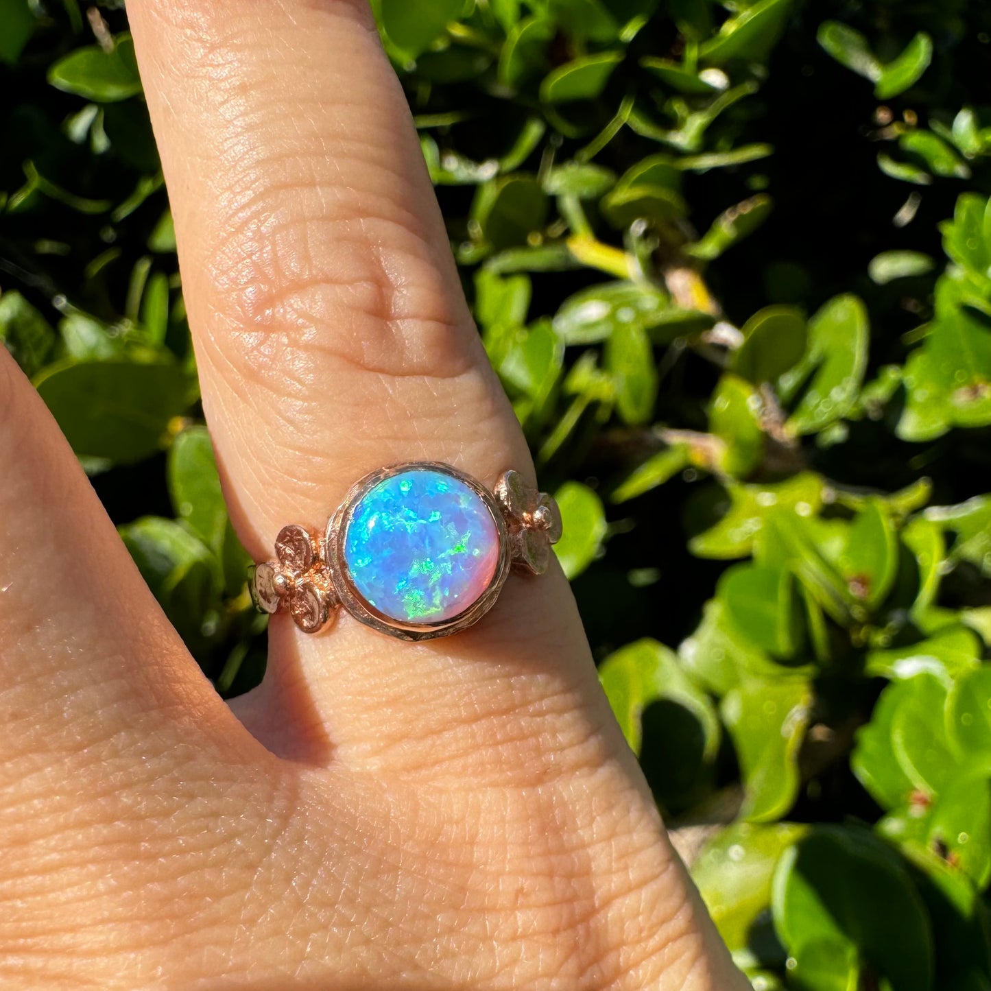 10K gold ring set with round Opal with vibrant flashes of blue, green and white