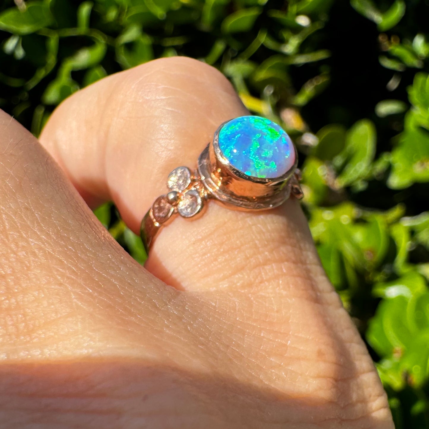 10K gold ring set with round Opal with vibrant flashes of blue, green and white