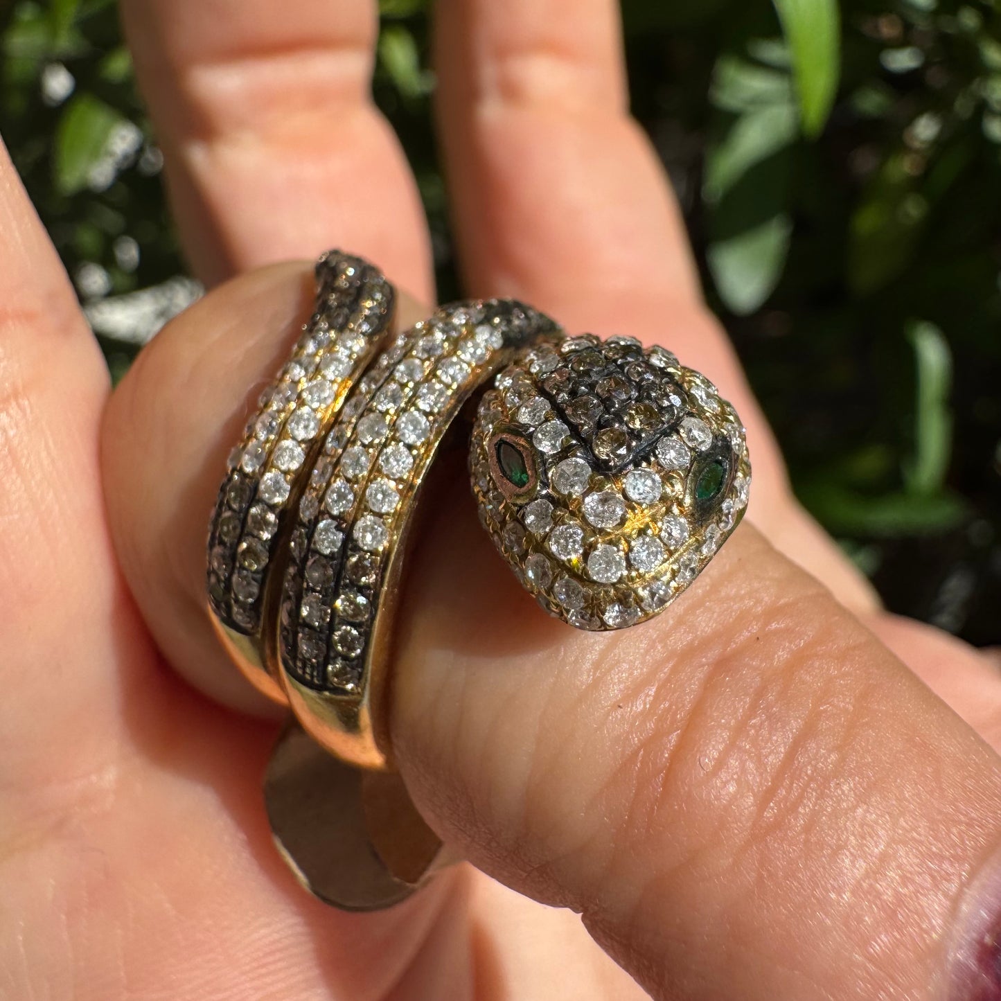 14K gold snake ring fully set with white and black Diamonds, creating a striking contrast and luxurious sparkle.