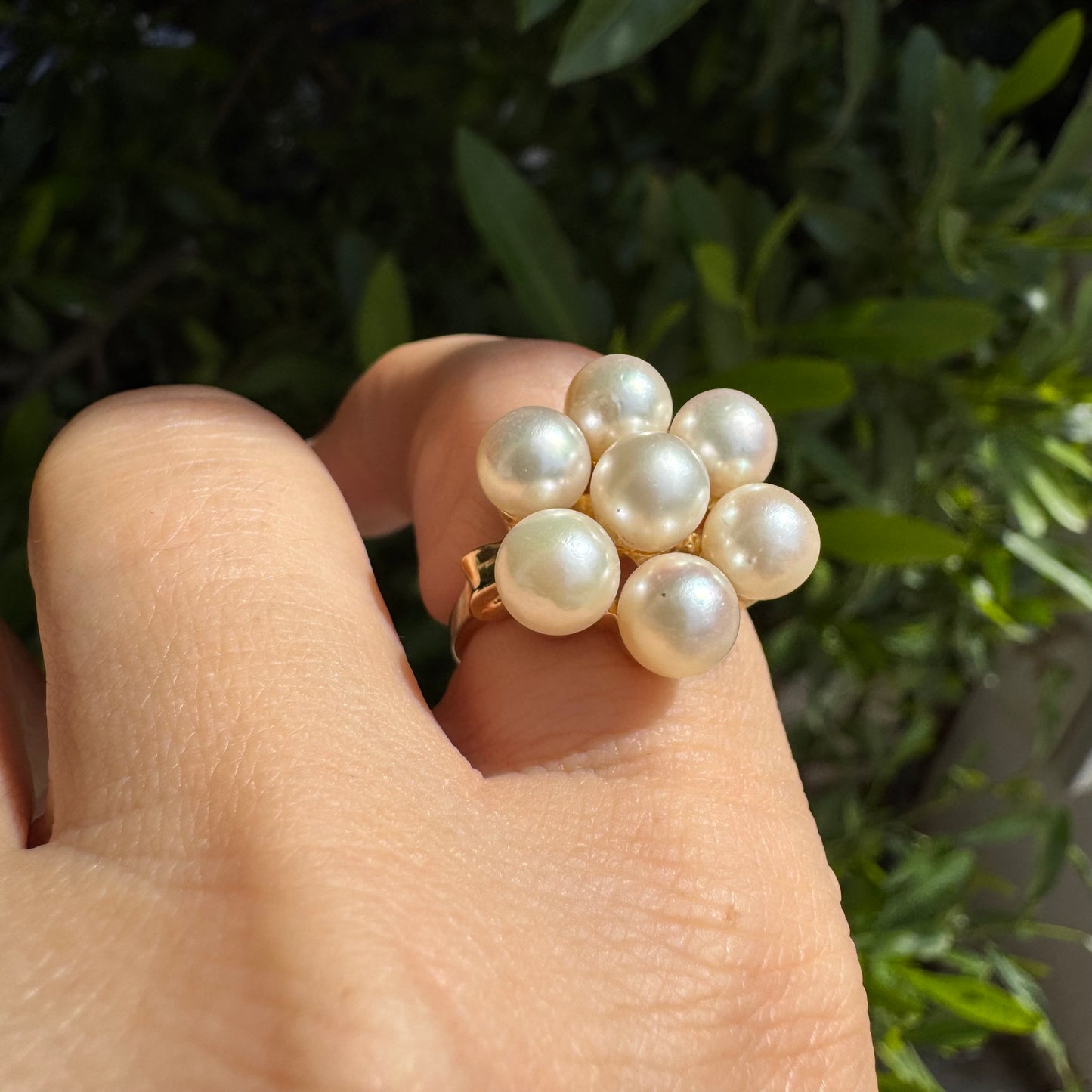 14K gold ring set with seven round Pearls in a bold floral cluster