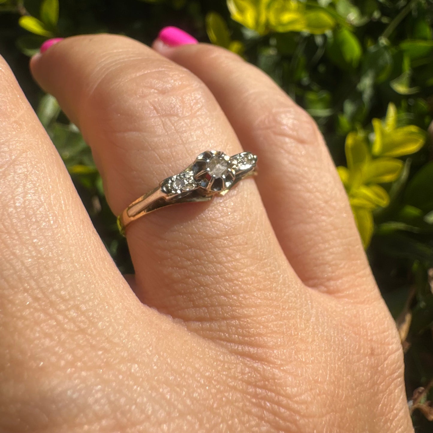 18K gold ring set with an old-cut center Diamond & side Diamonds