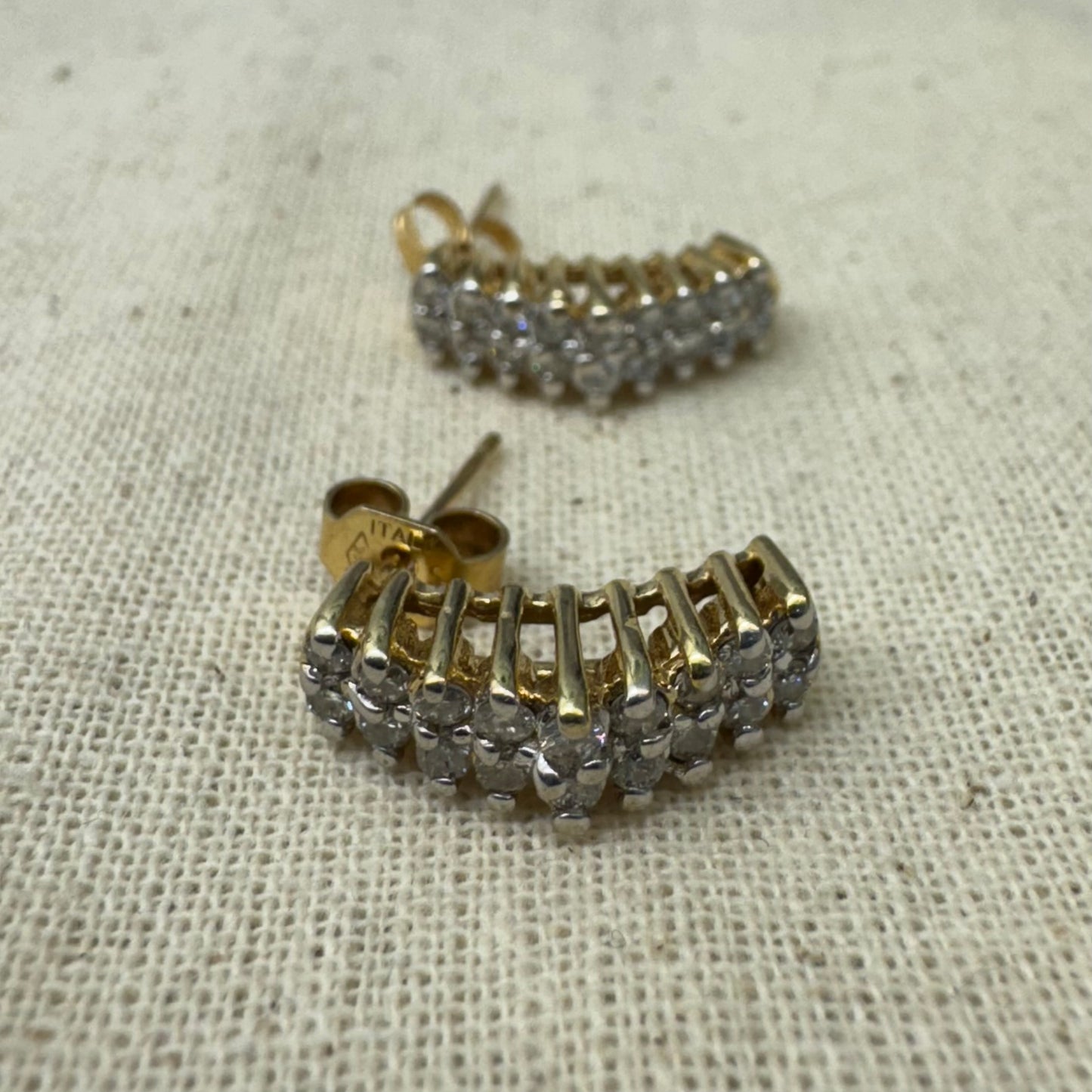 14K gold half-hoop earrings set with sparkling Diamonds in a dense pavé setting