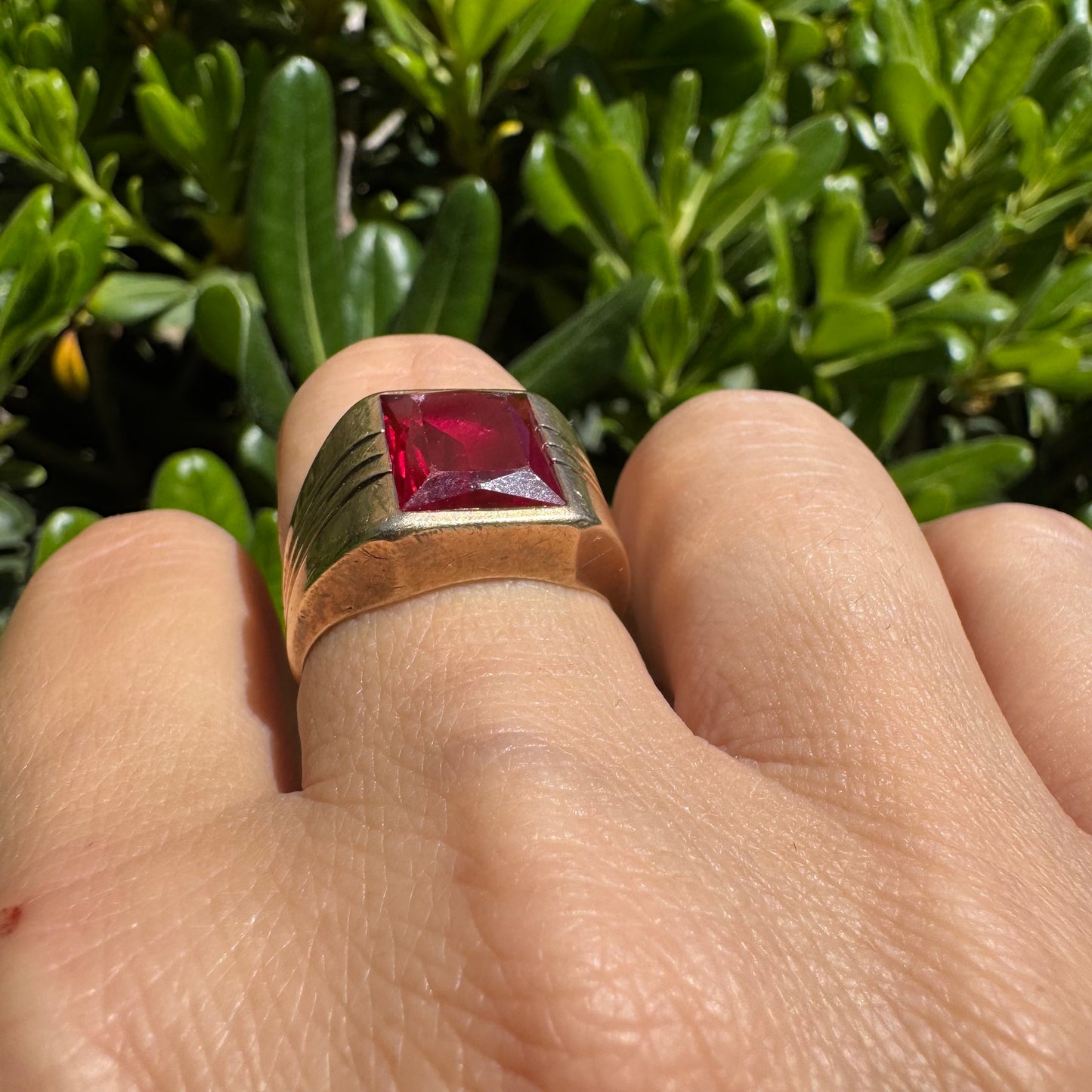 10K gold ring set with a bold red rectangular gemstone