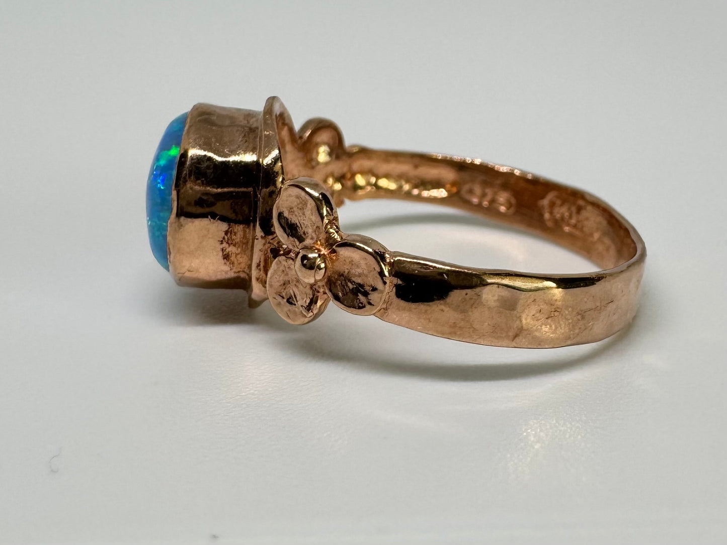 10K gold ring set with round Opal with vibrant flashes of blue, green and white