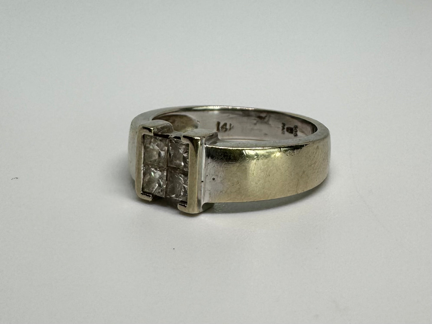 14K gold ring set with 4 square-cut Diamonds