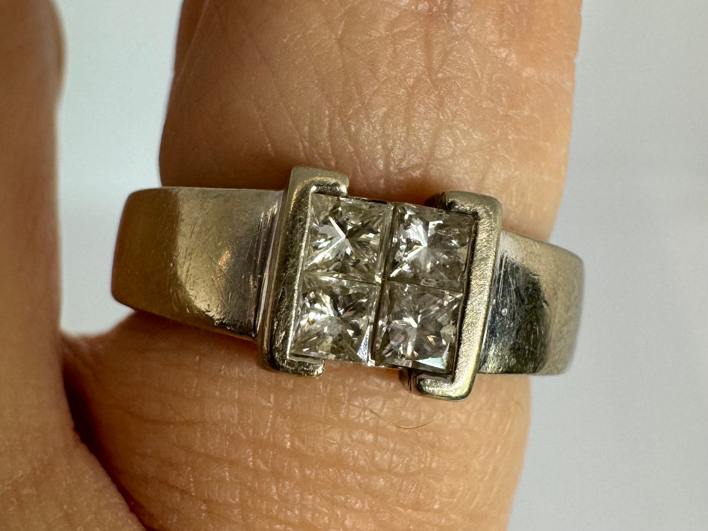 14K gold ring set with 4 square-cut Diamonds