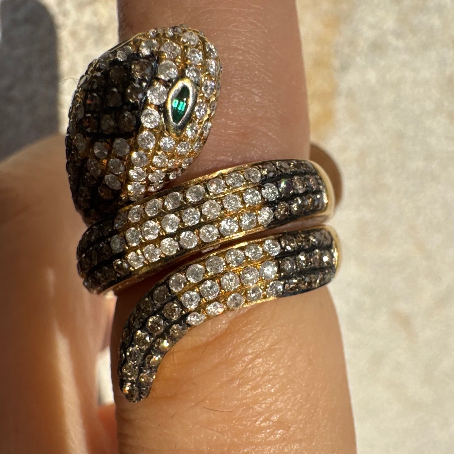 14K gold snake ring fully set with white and black Diamonds, creating a striking contrast and luxurious sparkle.
