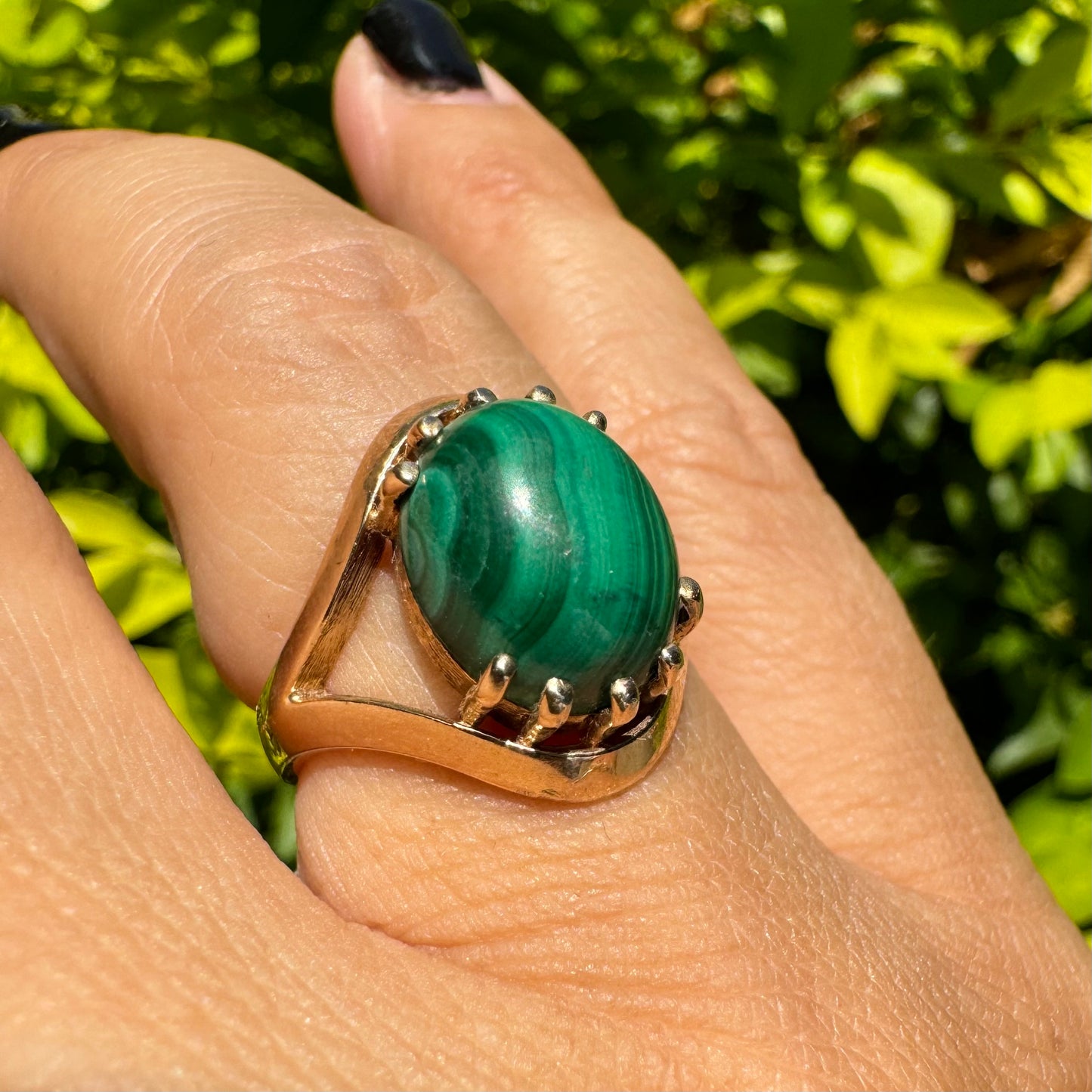 14K gold ring set with a polished Malachite cabochon