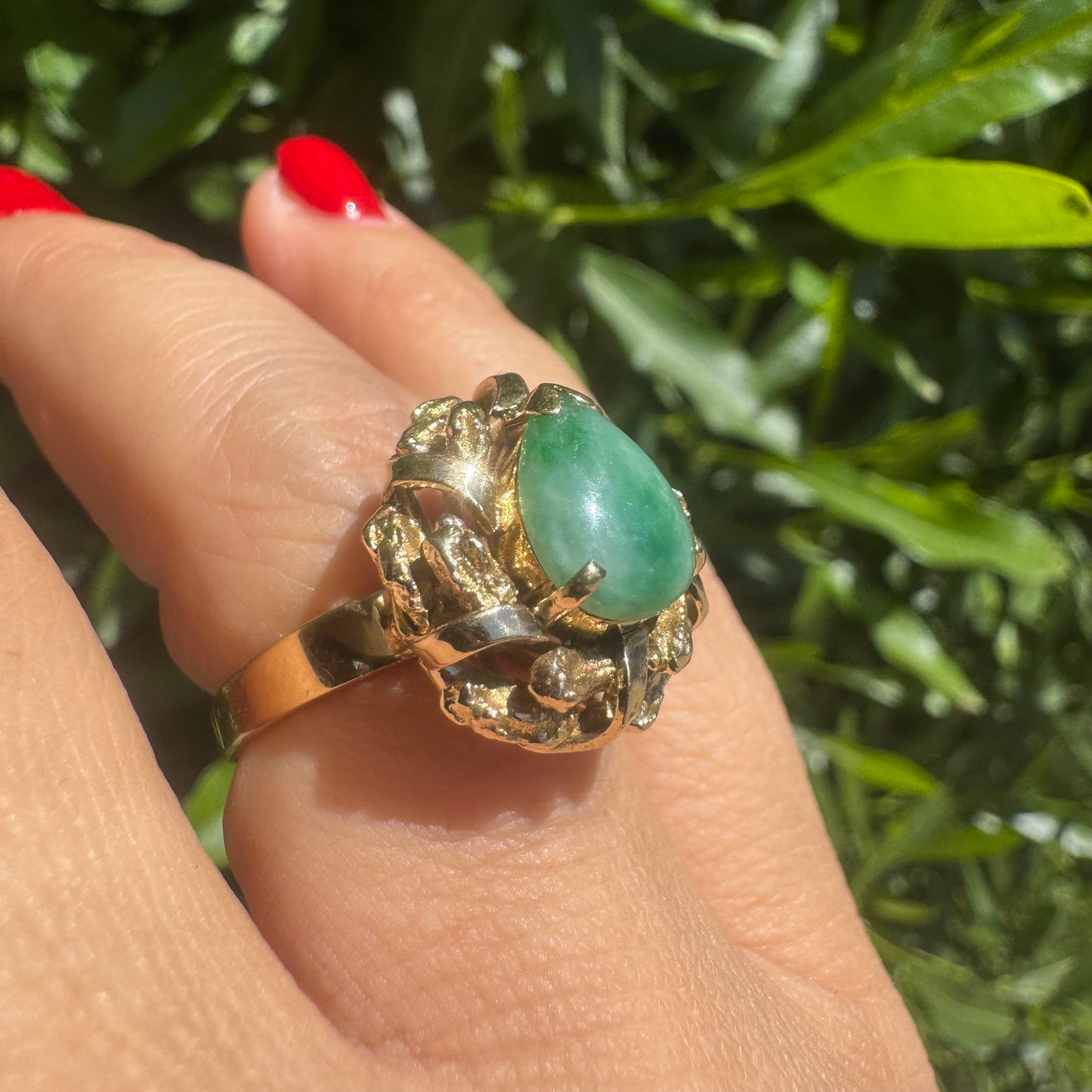 14K gold ring set with a pear-shaped Jade cabochon