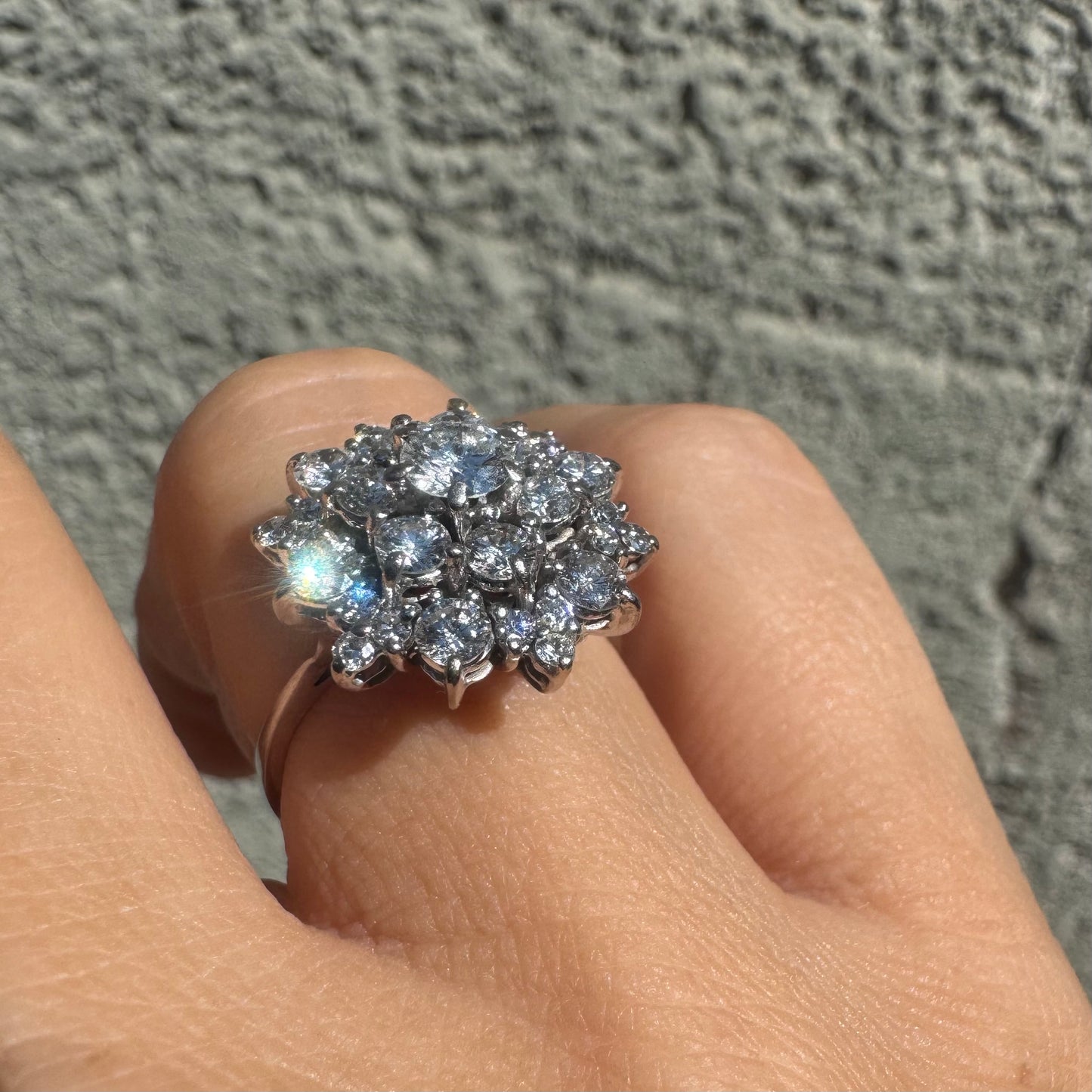 18K gold ring set with sparkling white Diamonds arranged in a floral cluster design