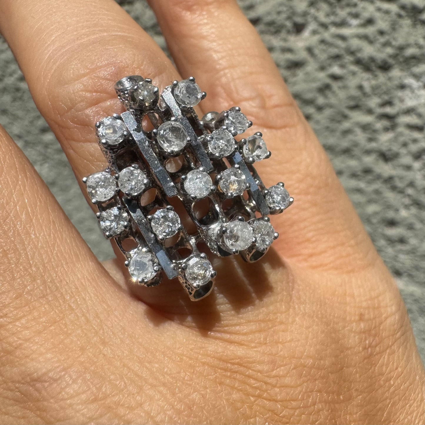 14K gold ring with a geometric design, set with multiple round Diamonds that create a sparkling, structured look.