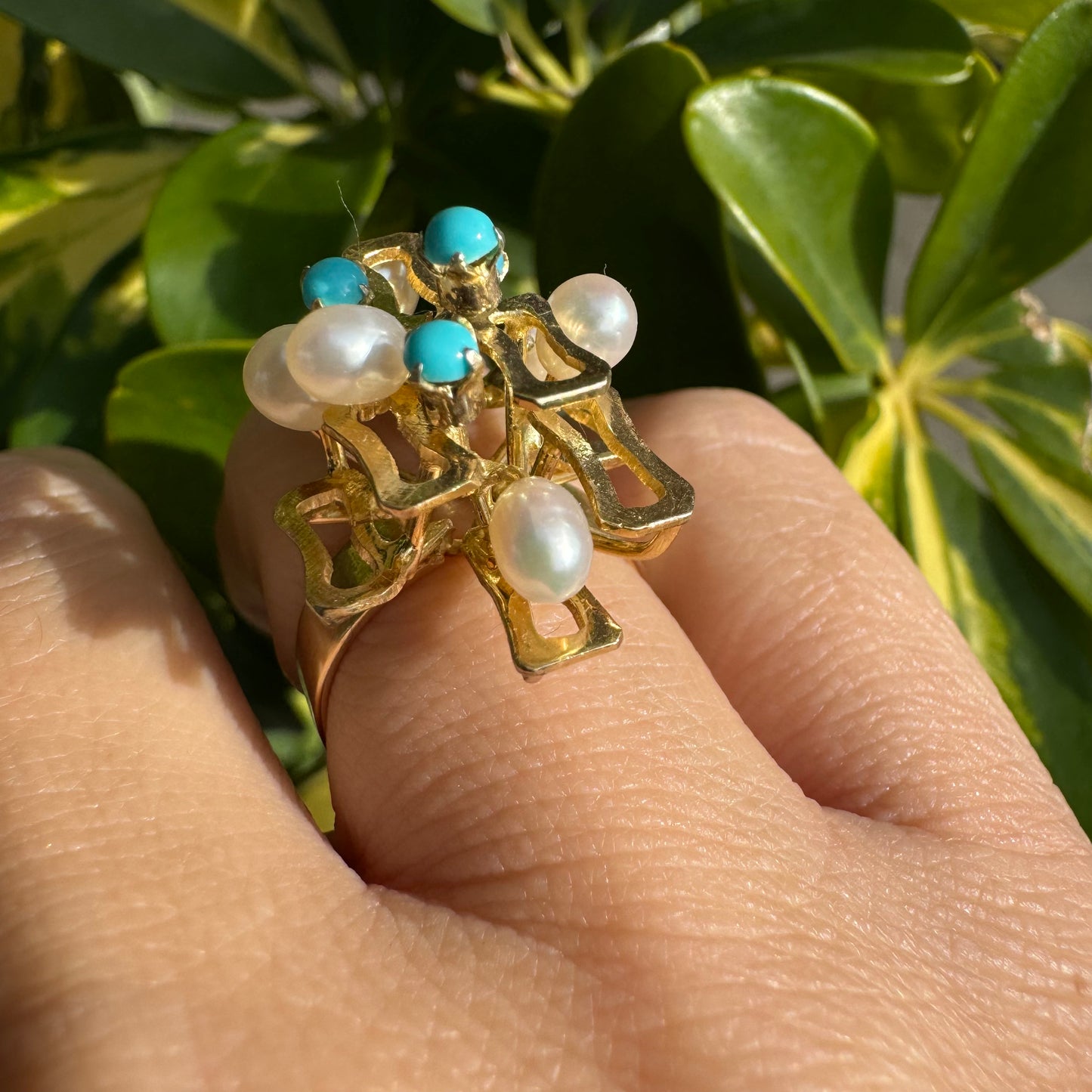 14K gold ring with a textured design, set with round white pearls and turquoise stones for a striking contrast.